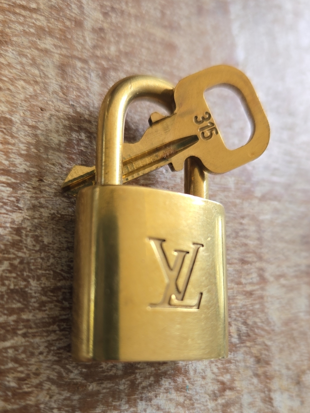 Authentic Louis Vuitton Solid Brass Padlock and Key Set #315. (BIN 011)